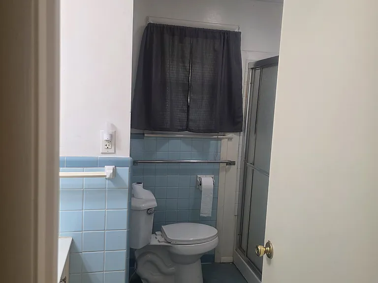 Single bathroom with stand up shower.
