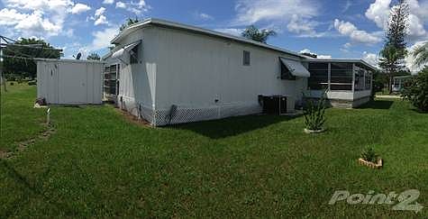 REAR OF HOME W SPACIOUS BACK YARD