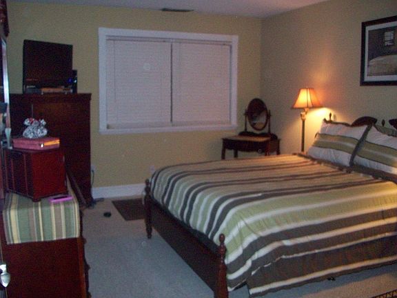 Bedroom has attached walk-in closet that can be used as study or nursery.