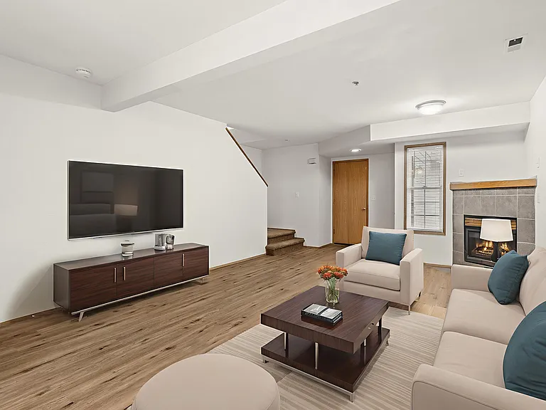 Bright and inviting living room, virtually staged to showcase spacious layouts, modern furnishings, and a cozy fireplace. Bright and inviting living room, virtually staged to showcase spacious layouts, modern furnishings, and a cozy fireplace.