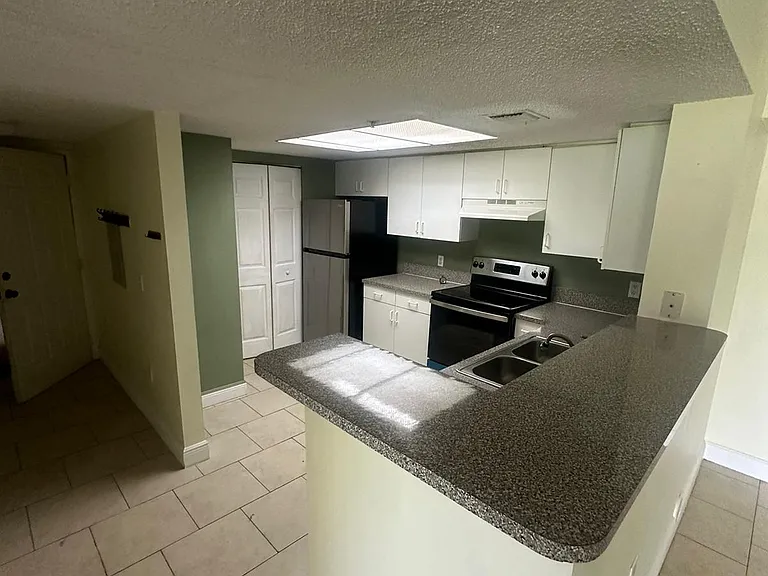 5005 Wiles Rd #102 — Photo 41