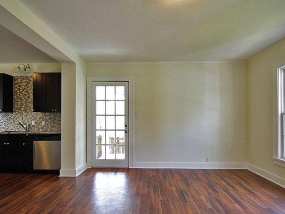 View of living room out to screened-in porch