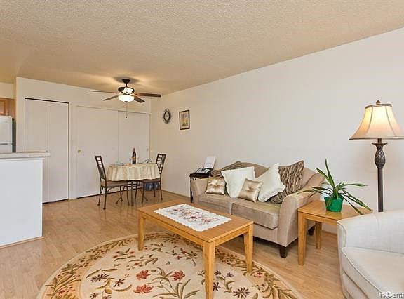 Open style concept kitchen, living room and dining area. Notice all the storage.