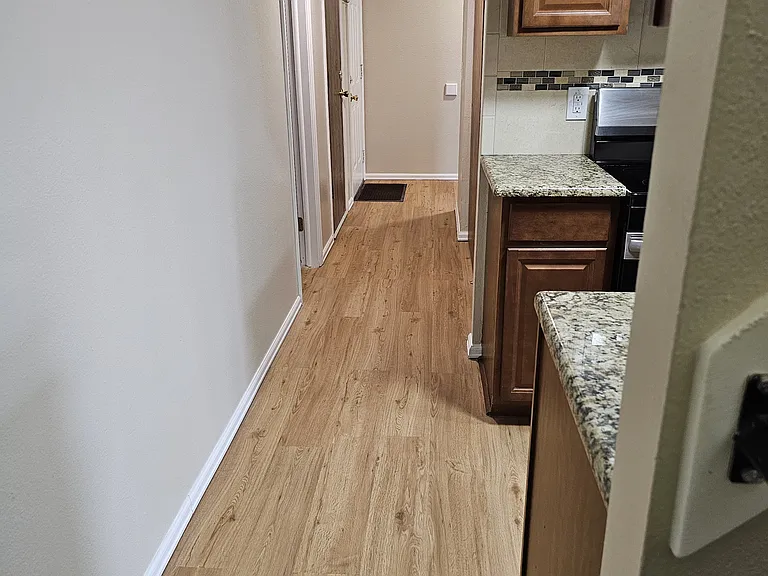 main hallway from kitchen to front door