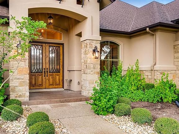 Just walk right up, turn the key, open these beautiful custom doors to your new home.