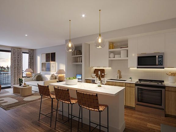 Gourmet kitchens with quartz countertops, 42-inch custom cabinetry with soft close, and under-cabinet lighting.