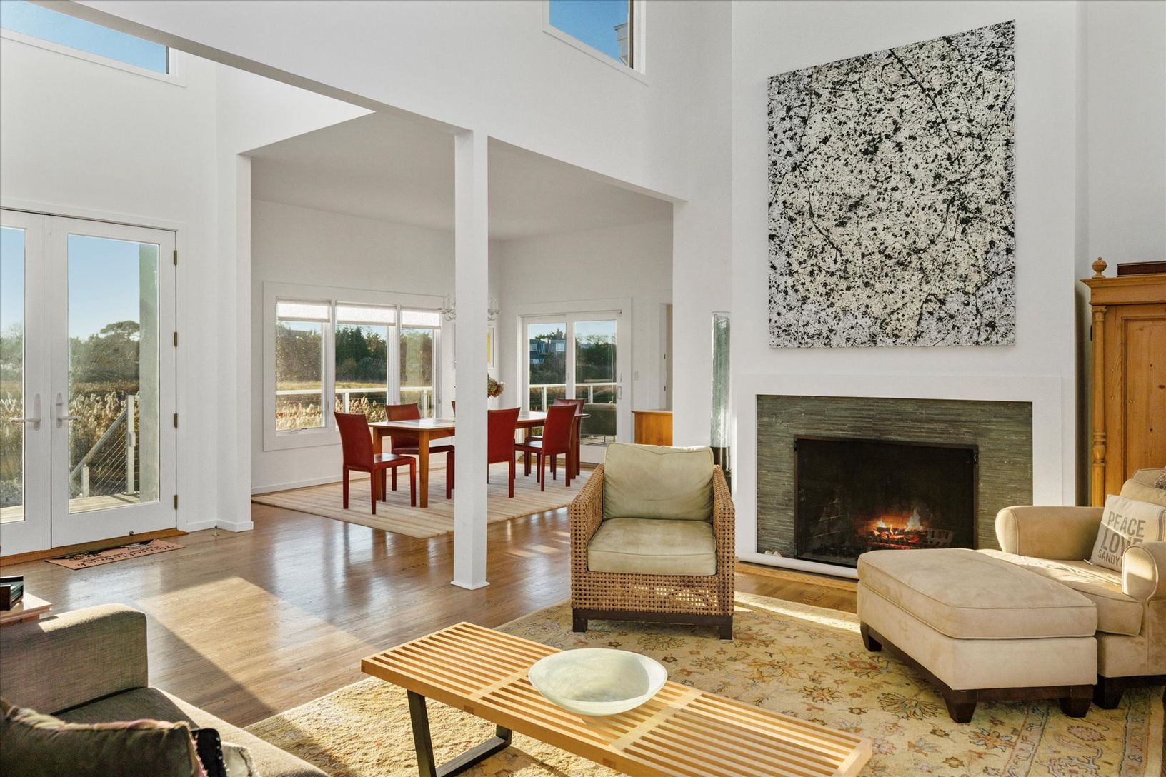  Living room featuring french doors, a vaulted ceiling and fire place