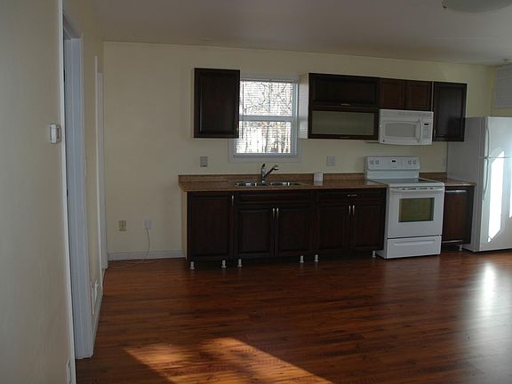 Other side of the living room get's plenty of sunlight early morning through the afternoon from multiple angle windows.