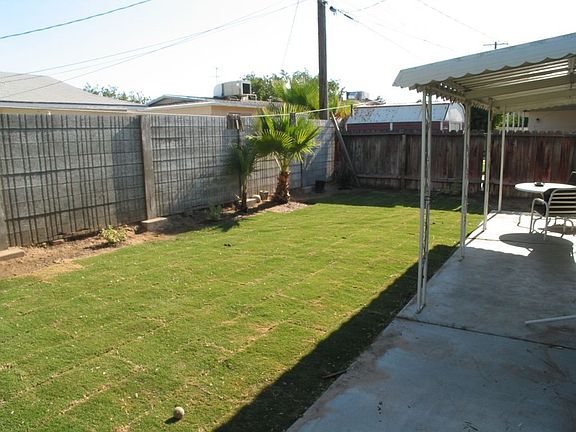 Backyard with Covered Patio and Storage Shed