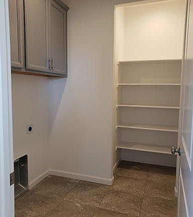 Laundry room with pantry.