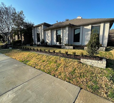 Front View - Sidewalk East. New landscaping.