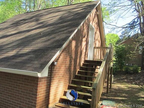 Entry to bonus area over detached garage. This bonus area is unfinished but could provide great man 