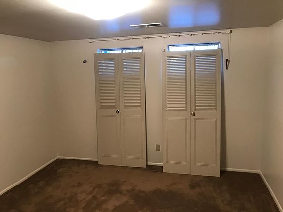 Basement bedroom (closet doors need to be rehung after new paint)