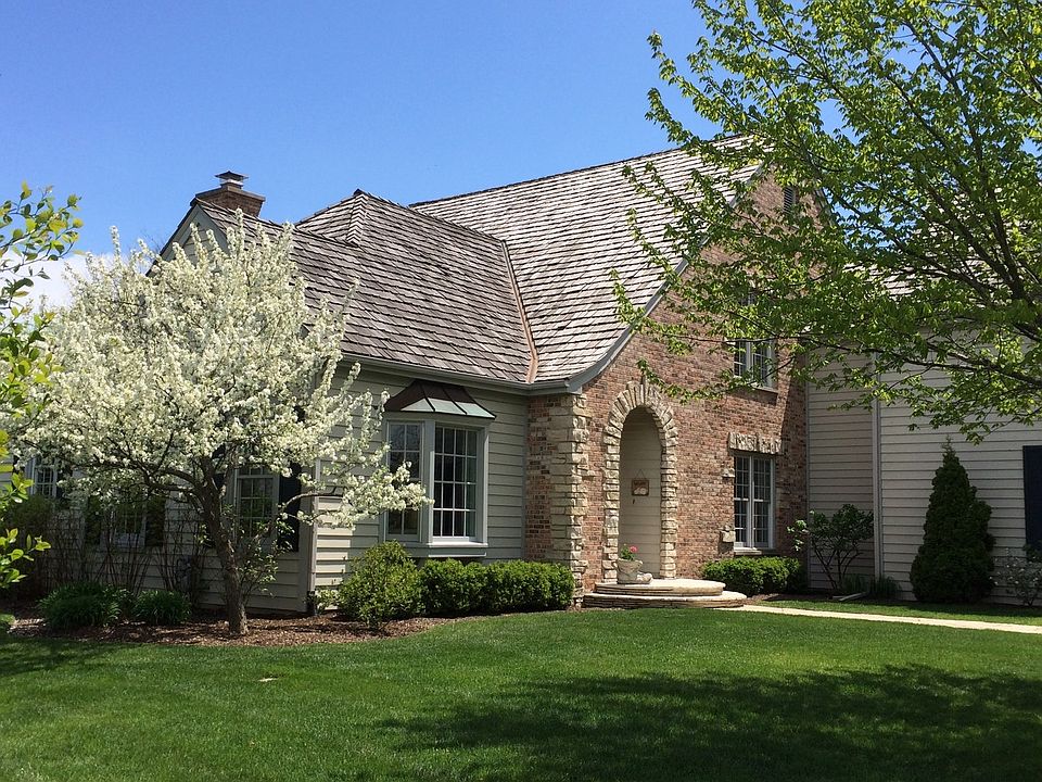 Welcome home to an architectural treasure in Conway Farms! Custom-designed home has Cotswold brick e