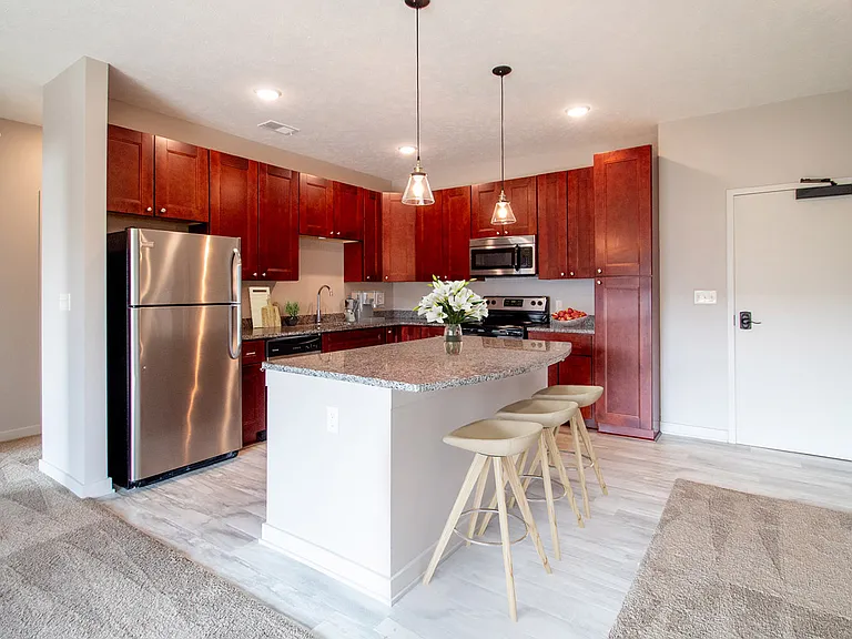 Kitchen island with seating in a unit at Avenue 204.