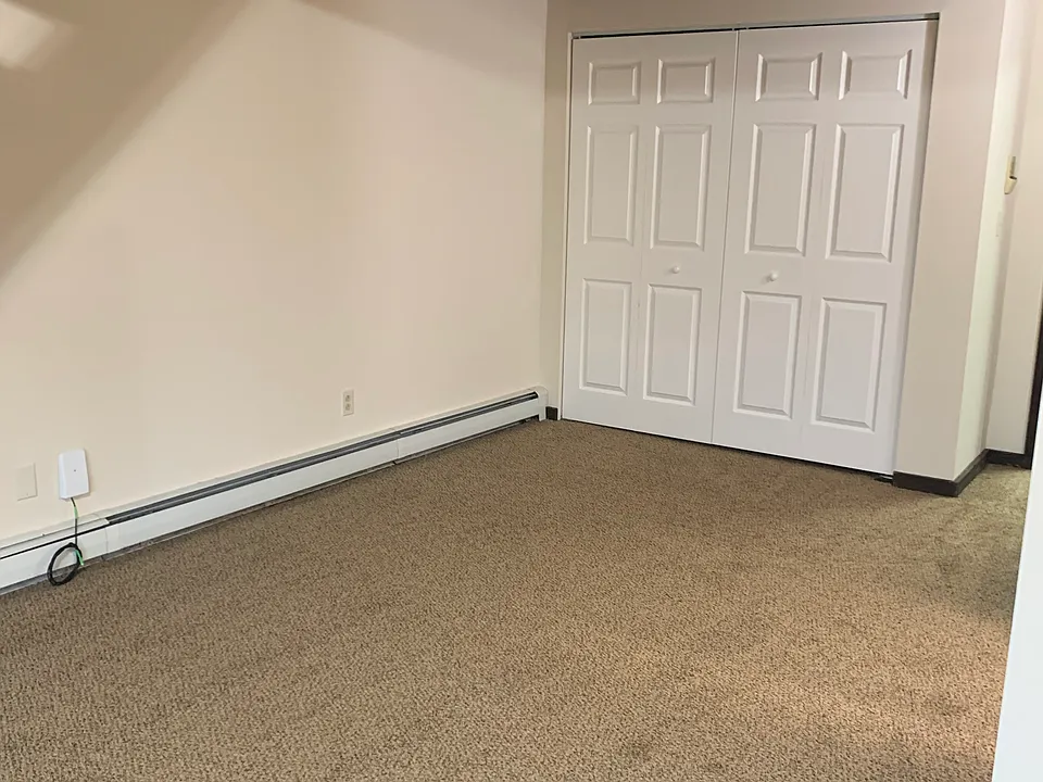 Dining area and closet near entry