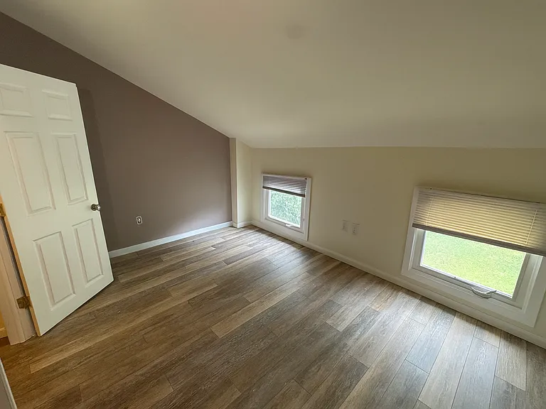3rd Floor Back Bedroom. ** This photo was altered with similar flooring that is being installed