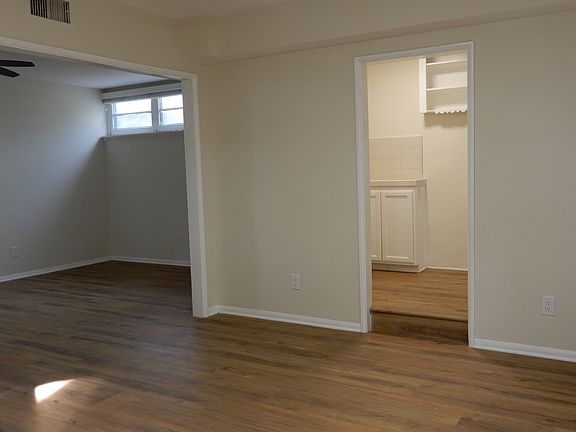 Dining room looking into kitchen and living room.