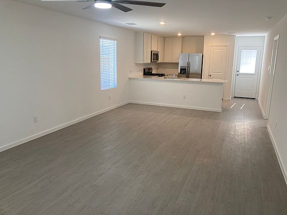 Family Room, Dining Room, and Kitchen taken from the Entry Hall.