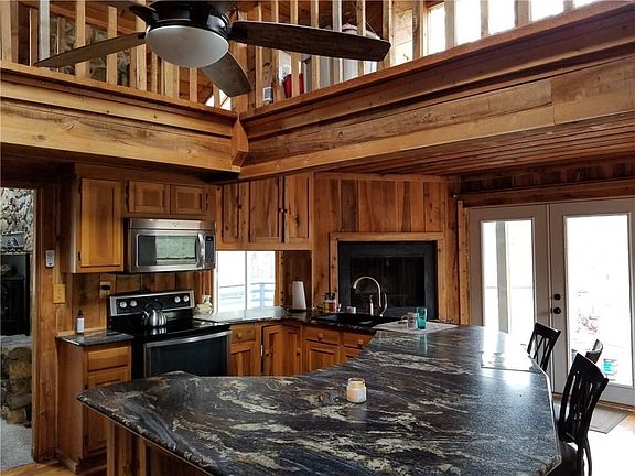 Notice the huge breakfast bar with a granite top!