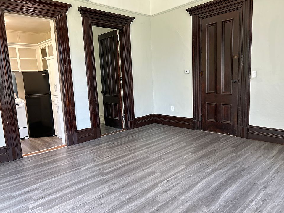 Living Room, entrance to kitchen, hallway to bedroom, and entry door into building lobby