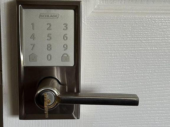 Secure entry with a keypad deadbolt and lever handle for convenient keyless access.