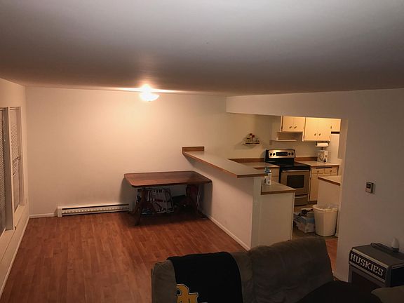 Kitchen w dining area next to bar top eating area. Works great with stools.