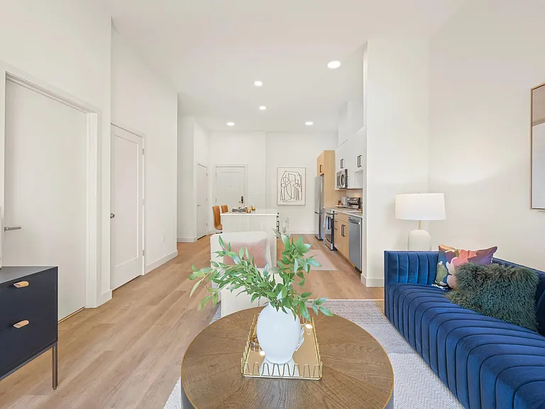 Open concept floor plans with wood-style plank flooring in kitchen and living room areas.