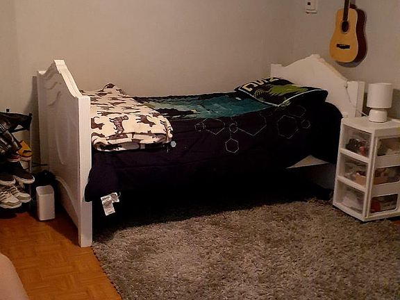 Living room being used as second bedroom