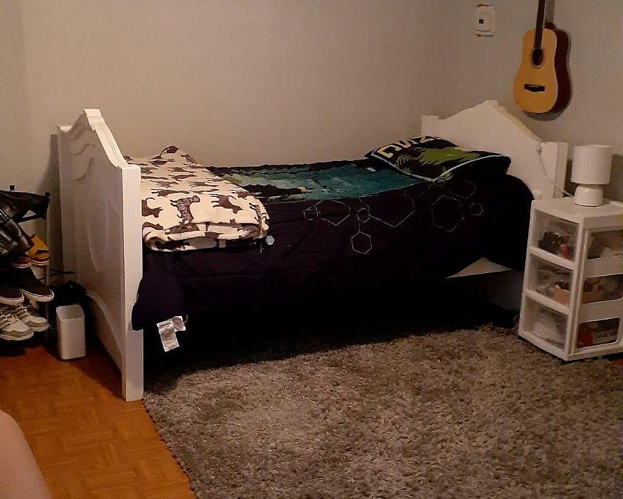 Living room being used as second bedroom