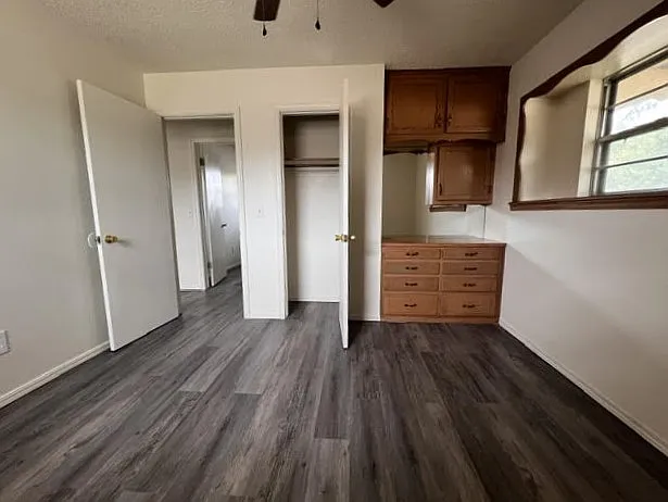 Bedroom with built in desk