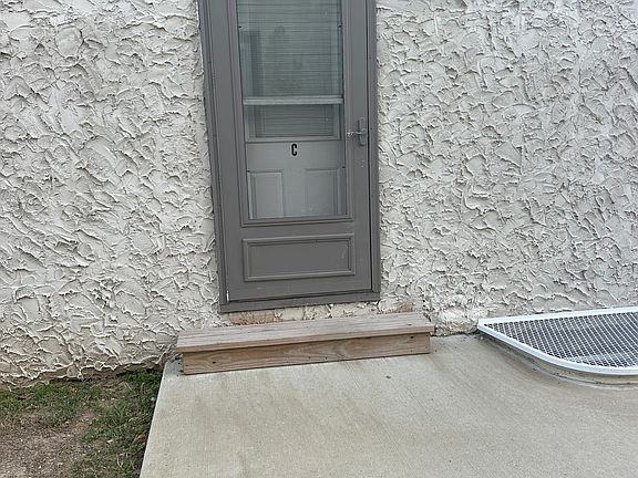 Back entrance with shared patio