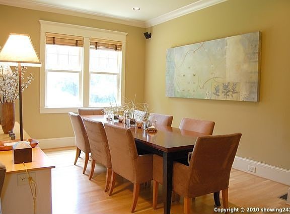 Large dining portion of Great Room is separated from the living area by custom built ins.