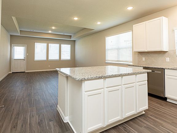 Kitchen to Dining Area and Family Room