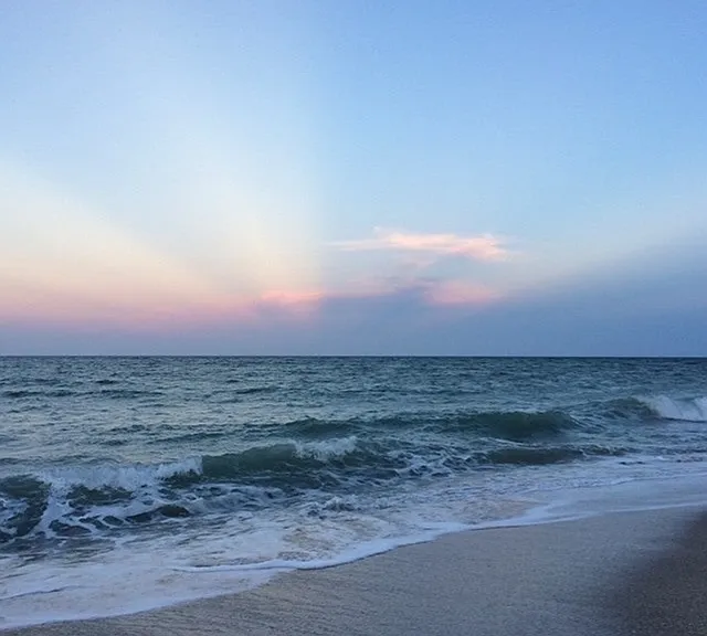 Sun rise from private beach gate.