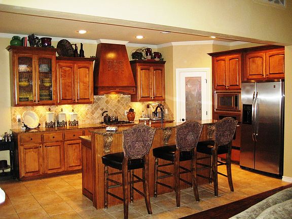 Kitchen with full granite and stainless