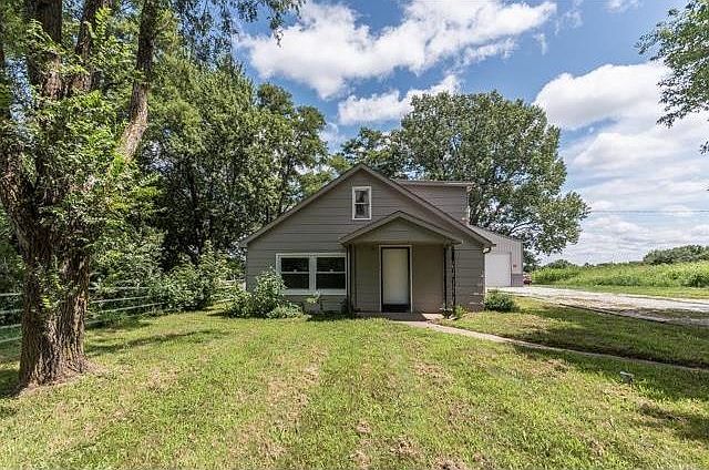 Welcome to 12223 S. Brown Road, Lone Jack, MO 64070...Just a simple farmhouse on two acres...but, the location is AMAZING if you like nature!
