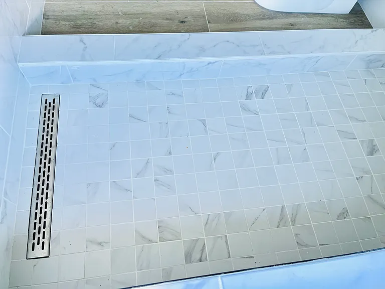 Shower with tiled in drain