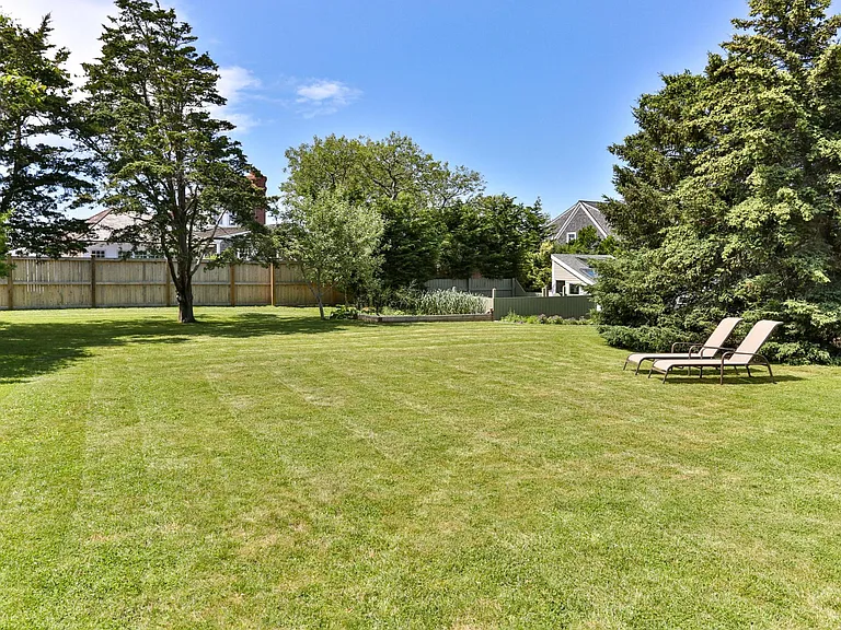 Spacious back yard (covered porch with seating and dining for 8 not shown)