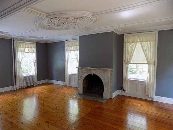 Beautiful Living/Dining with marble fireplace