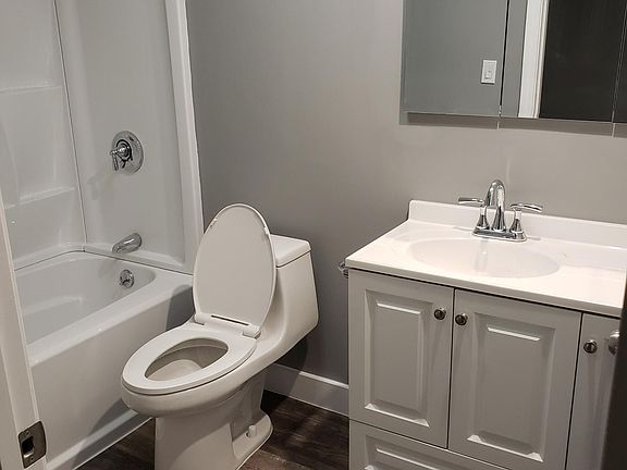Bathroom with light fixture that is Bluetooth enabled, listen to your favorite music while on the shower.