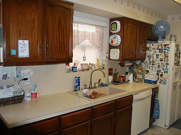 Kitchen is not updated, but has been very, very well maintained.  The cabinets were refinished, the ovens were replaced, the updated feature of a built-in microwave was added.