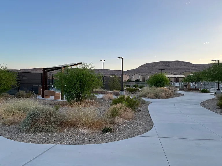 Big new park with huge dog parks, tennis/pickle ball court, playground, splash pad at walking distance from the house