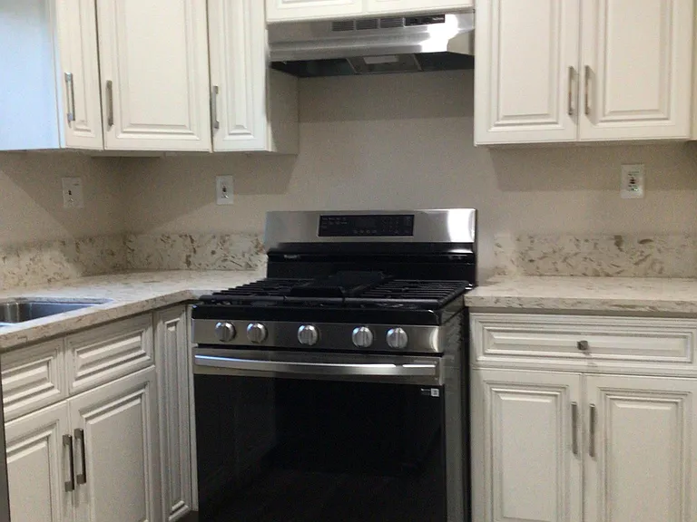 Kitchen with stove and refrigerator