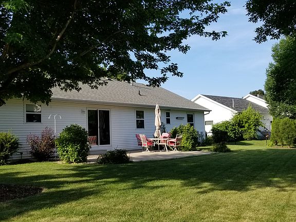 Back w/beautiful landscaping