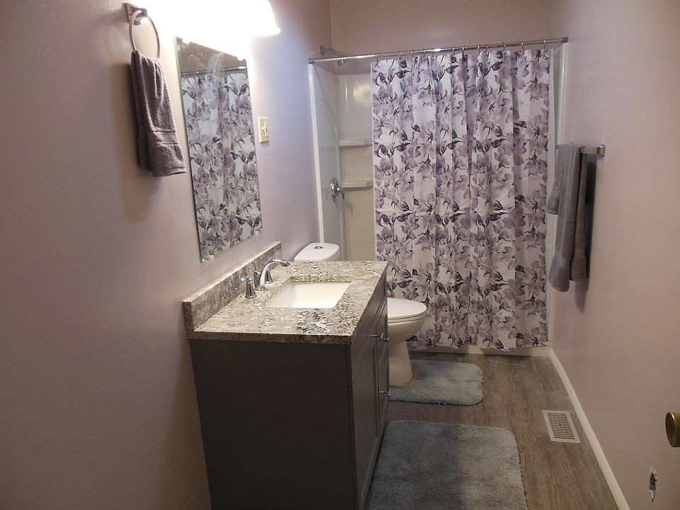 All new bath with Quartz top vanity and vinyl plank flooring.