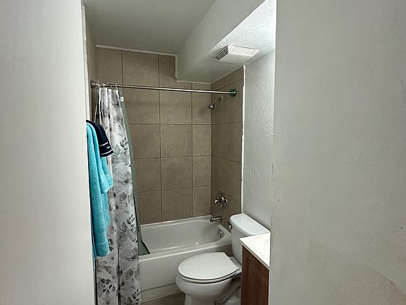 Bathroom with shower over tub