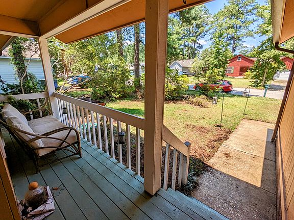 Front covered deck perfect to sit and relax on in a quiet neighborhood