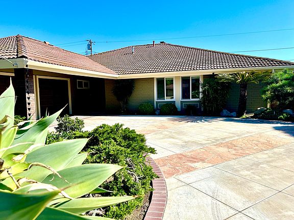 Semi-Circular Drive leading to Garage and Front Entry.