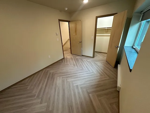 Bedroom with closet door open